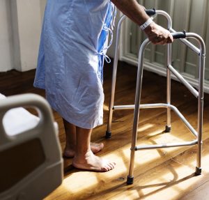 old woman with walking aid