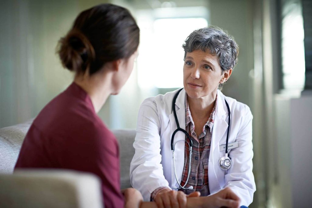 doctor discussing with patient