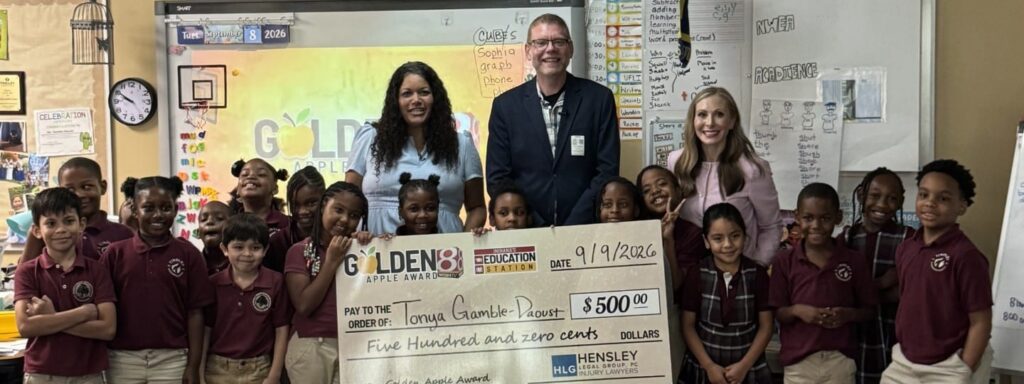 Mrs. Tonya Gamble-Daoust receiving the first Golden Apple Award of the 2026-2027 school year at Tindley Genesis Academy in Indianapolis, IN