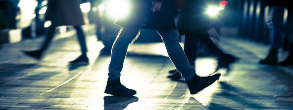 Pedestrians walking through The Village in Muncie, IN